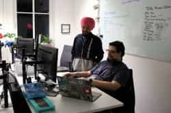 two men coding at global game jam