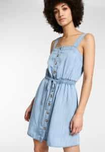 Woman wearing jeans dress by Funky Buddha